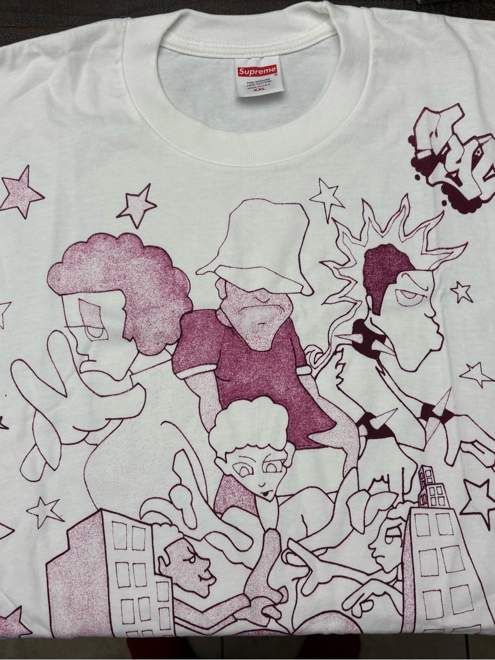 Supreme Downtown (RARE GRAIL) 
White Tee with Maroon Cartoon Graphic